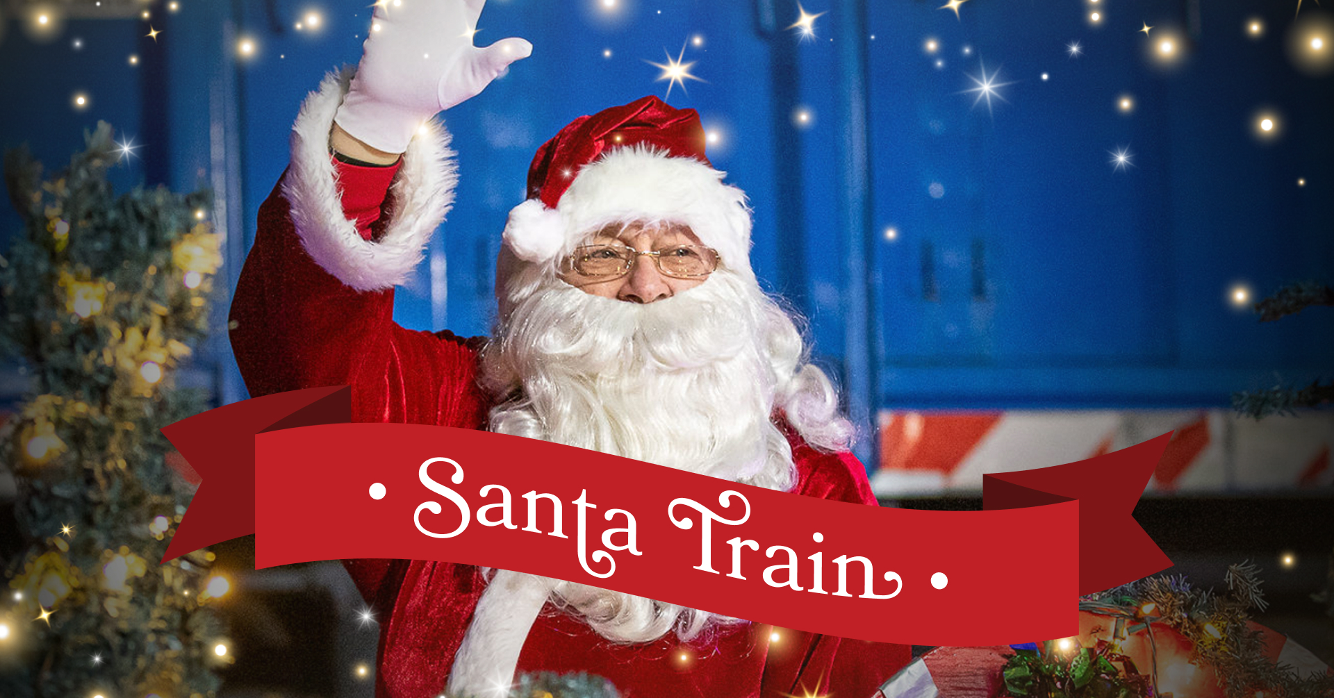 Image of Santa waving in front of blue and white locomotive 1000.